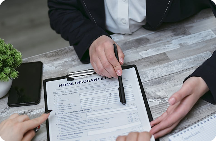 Insurance agent discussing insurance contract terms with customer in office